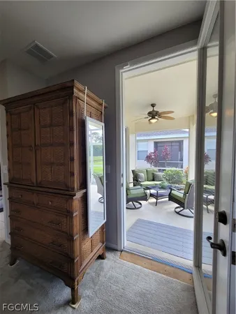 a view of a living room and floor to ceiling window