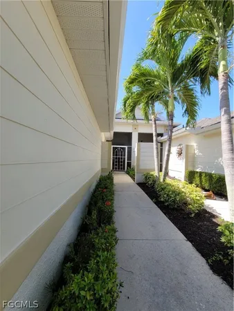 a house with palm tree in front of it