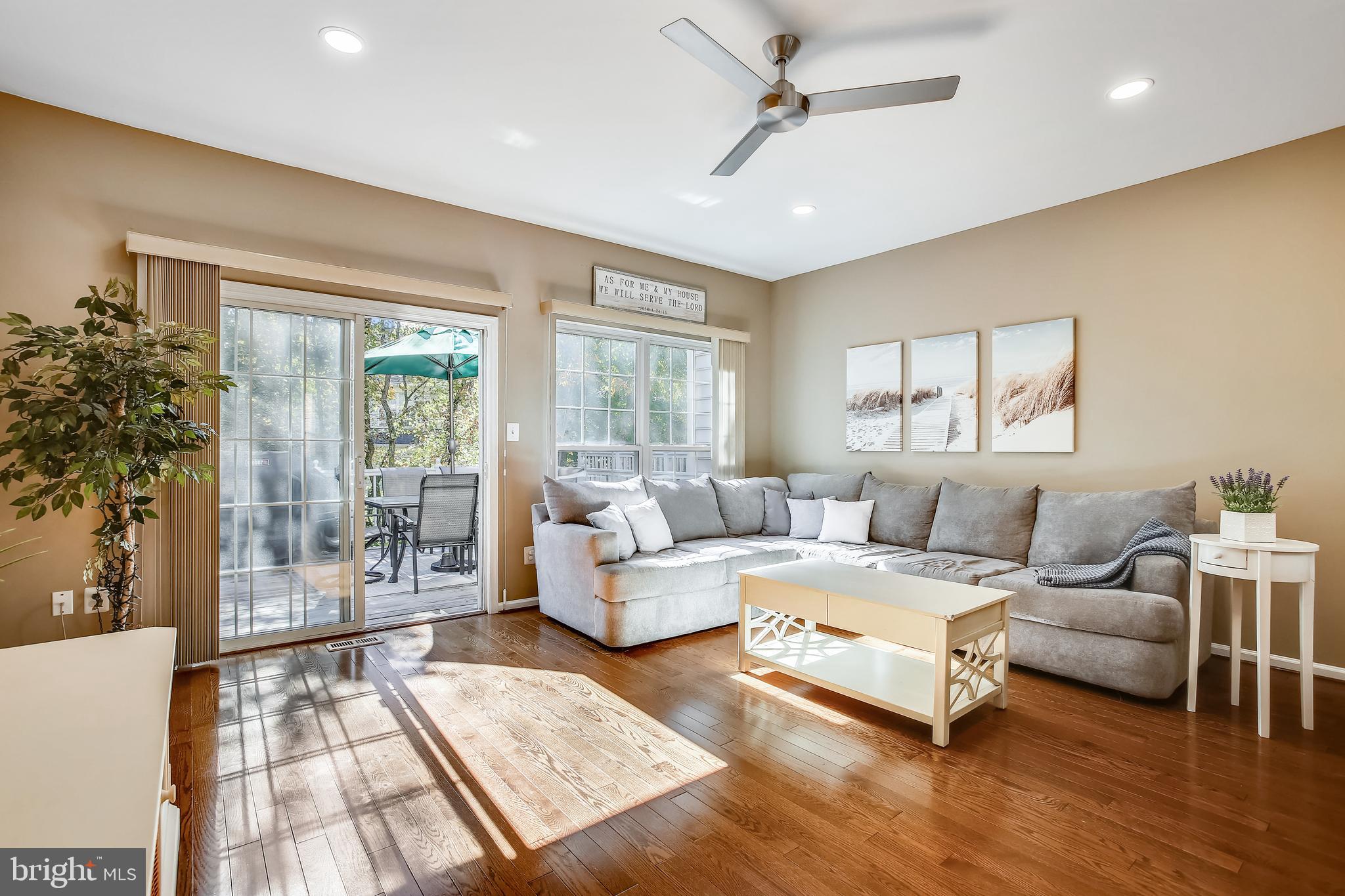 11489 Heritage Commons Way Reston, VA 20194 - Photo 14 of 54 Living Area Steps Out to Rear Wood Deck & Trees