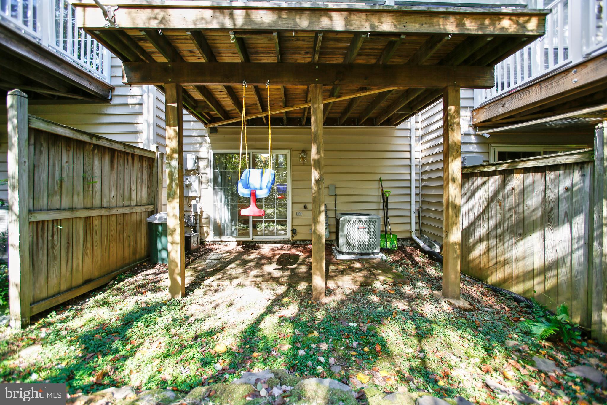 11489 Heritage Commons Way Reston, VA 20194 - Photo 40 of 54 Rear Yard and Patio under Wood Deck