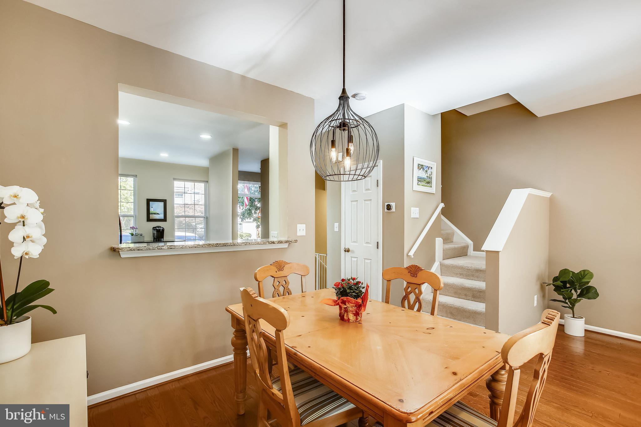 11489 Heritage Commons Way Reston, VA 20194 - Photo 9 of 54 Dining Area with Attractive Custom Light Fixture
