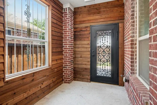 a view of front door of house with stairs
