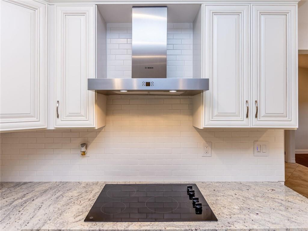 5520 Southwest 166th Avenue Southwest Ranches, FL 33331 - Photo 12 of 50 a view of kitchen with granite countertop white cabinets and a sink
