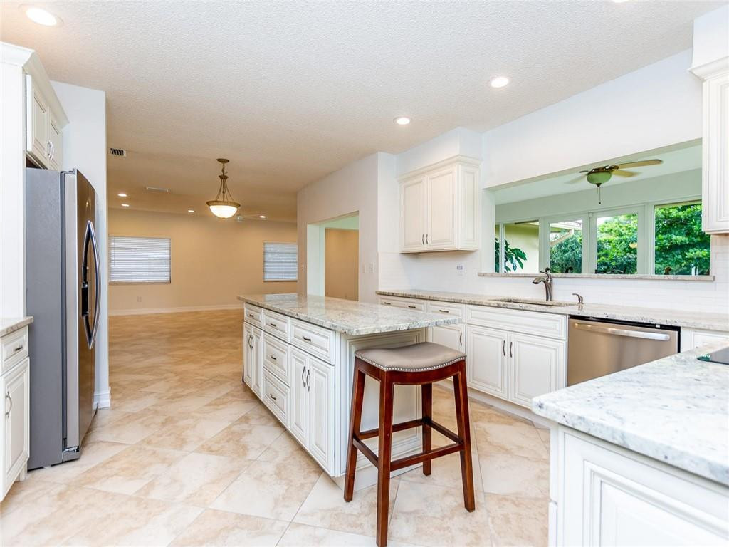 5520 Southwest 166th Avenue Southwest Ranches, FL 33331 - Photo 15 of 50 a large kitchen with kitchen island a sink stove and refrigerator