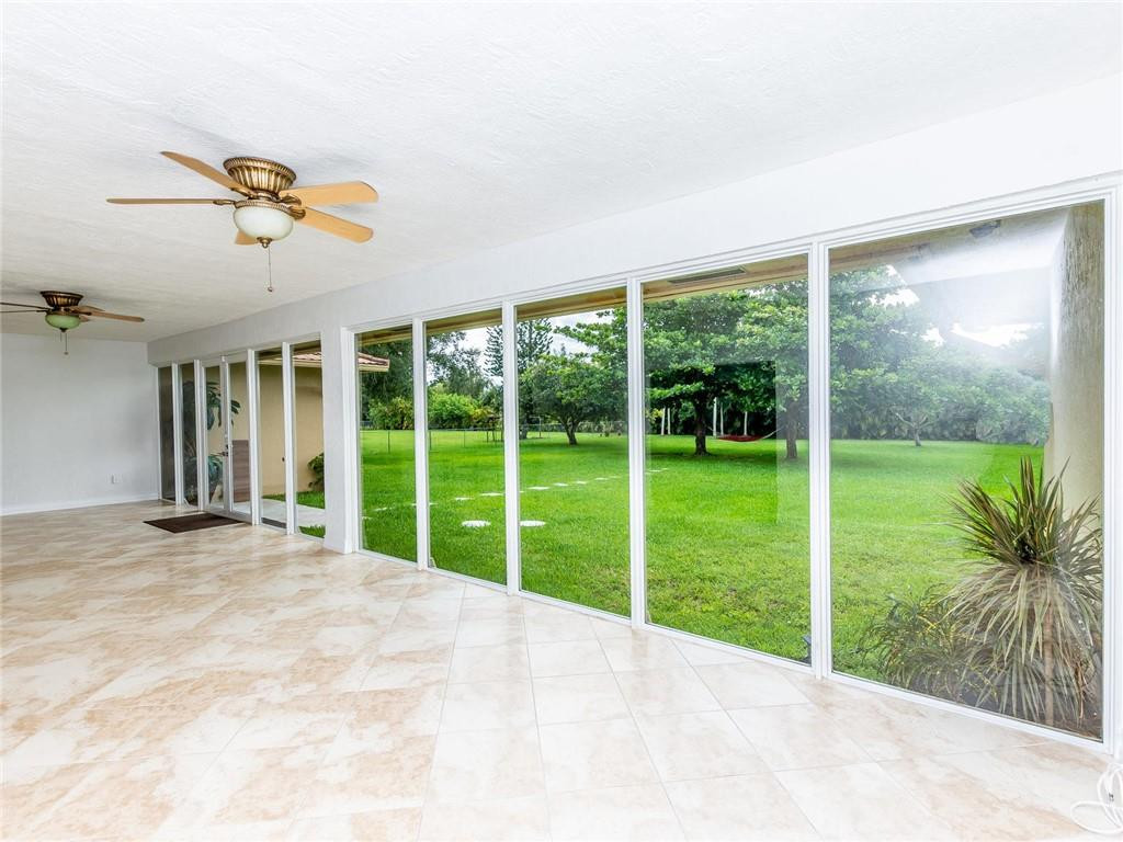 5520 Southwest 166th Avenue Southwest Ranches, FL 33331 - Photo 20 of 50 a view of a porch with a floor to ceiling window and a yard