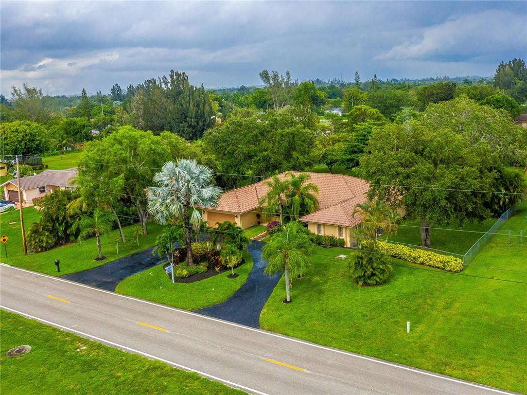 5520 Southwest 166th Avenue Southwest Ranches, FL 33331 - Photo 2 of 50 an aerial view of a house with a yard