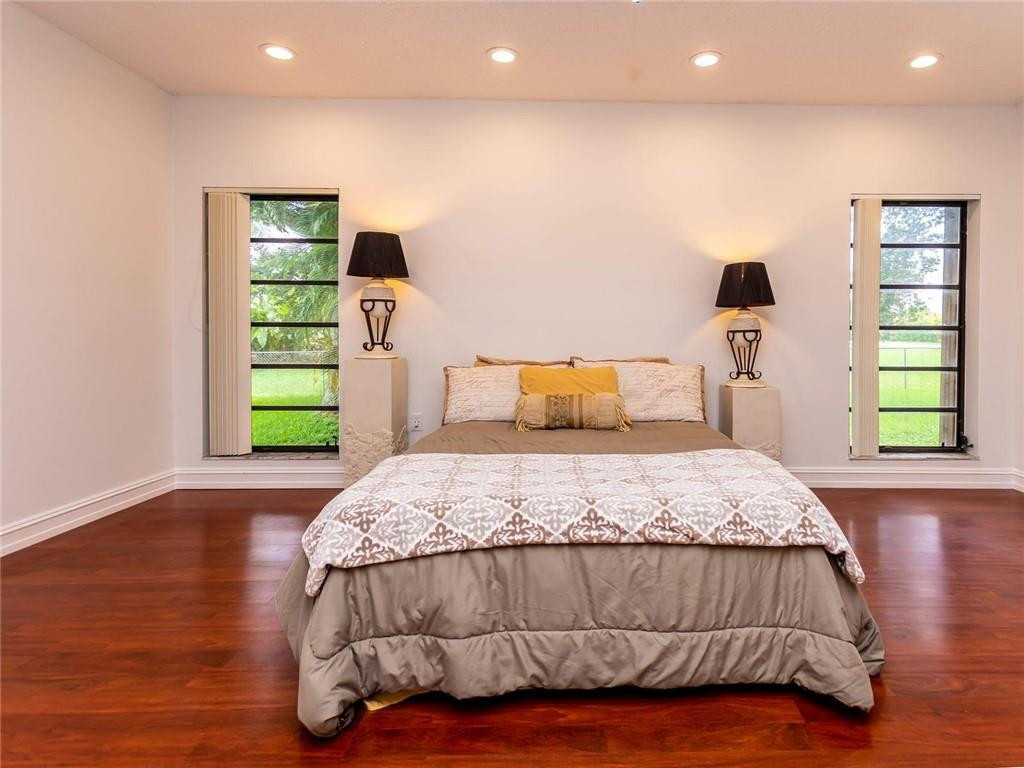 5520 Southwest 166th Avenue Southwest Ranches, FL 33331 - Photo 22 of 50 a bedroom with a bed and a window