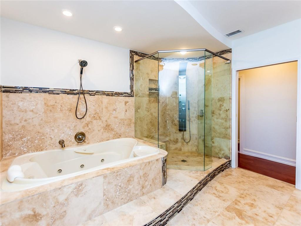 5520 Southwest 166th Avenue Southwest Ranches, FL 33331 - Photo 24 of 50 a bathroom with a bathtub a shower and a sink