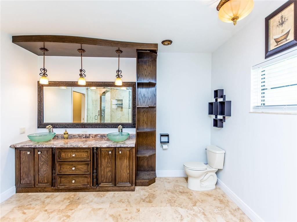 5520 Southwest 166th Avenue Southwest Ranches, FL 33331 - Photo 28 of 50 a bathroom with a sink and a mirror