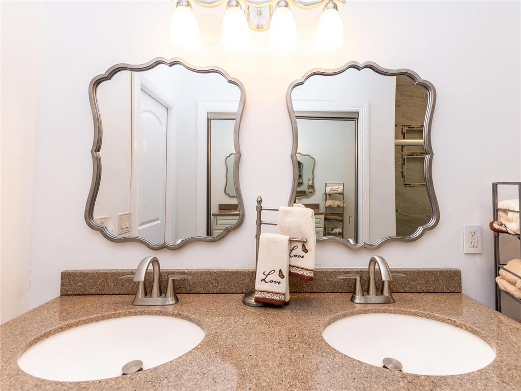 5520 Southwest 166th Avenue Southwest Ranches, FL 33331 - Photo 32 of 50 a bathroom with double vanity sinks and a mirror