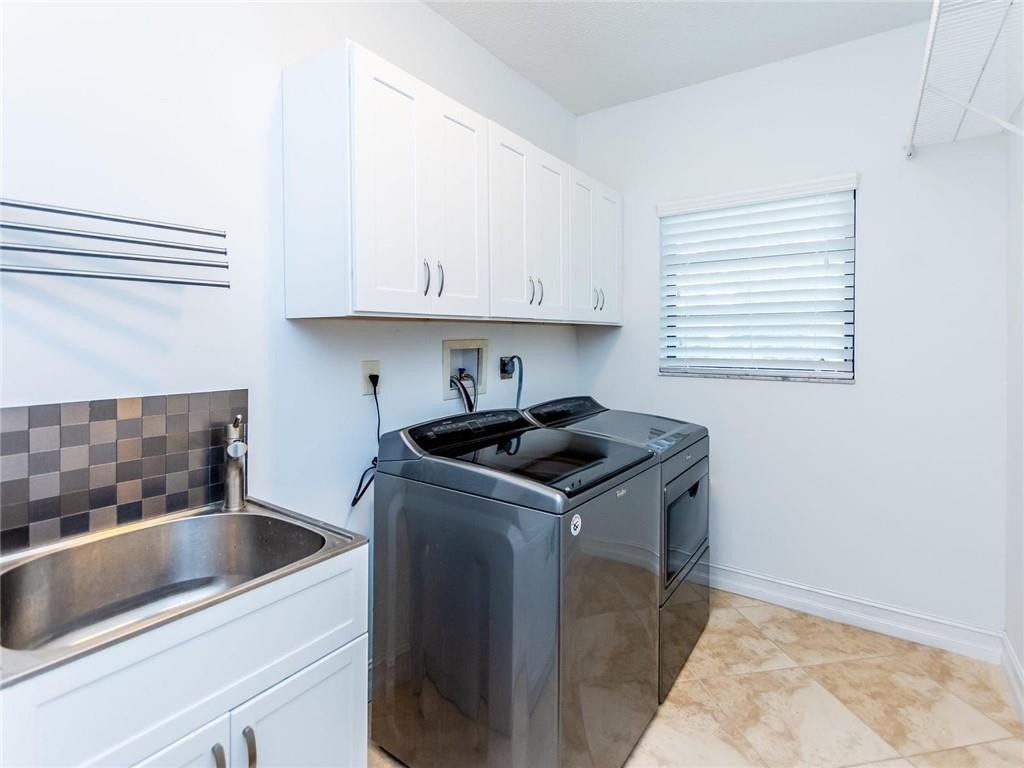 5520 Southwest 166th Avenue Southwest Ranches, FL 33331 - Photo 35 of 50 a kitchen with a sink stove and cabinets