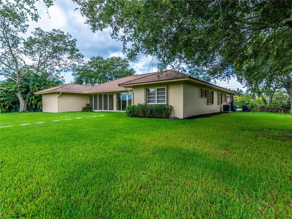5520 Southwest 166th Avenue Southwest Ranches, FL 33331 - Photo 45 of 50 a white house that has a tree in front of it
