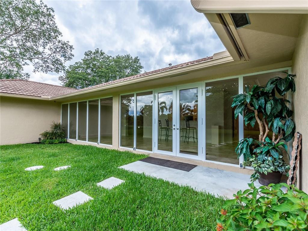 5520 Southwest 166th Avenue Southwest Ranches, FL 33331 - Photo 48 of 50 a view of a house with garden and porch
