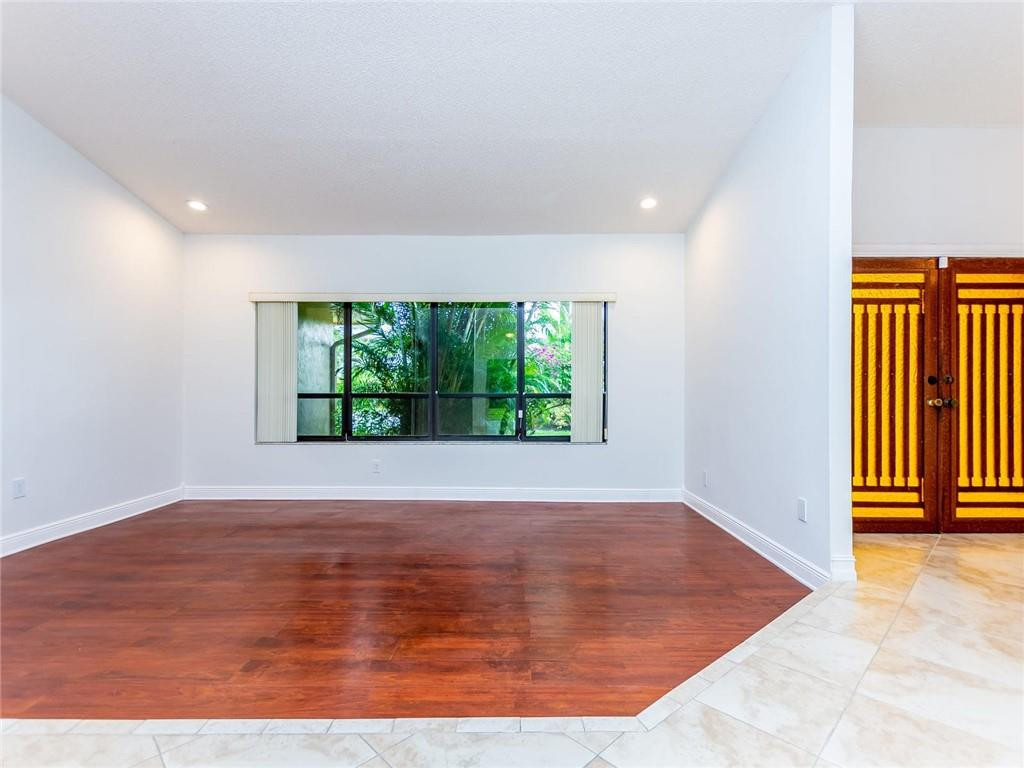 5520 Southwest 166th Avenue Southwest Ranches, FL 33331 - Photo 5 of 50 an empty room with wooden floor and windows