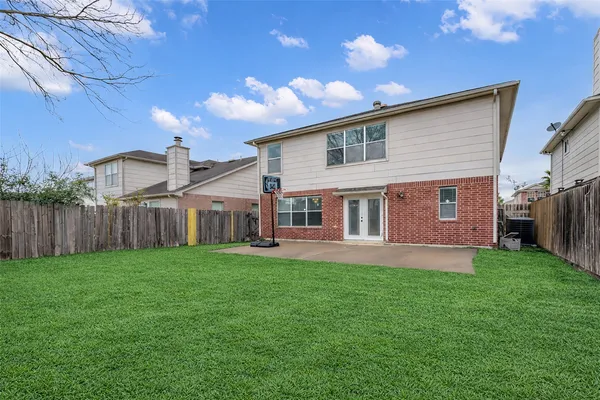 a view of a yard in front of house with a yard