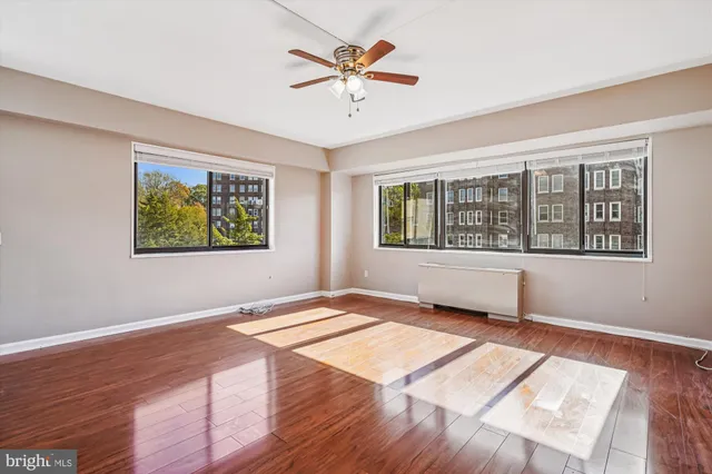 wooden floor in an empty room with a window