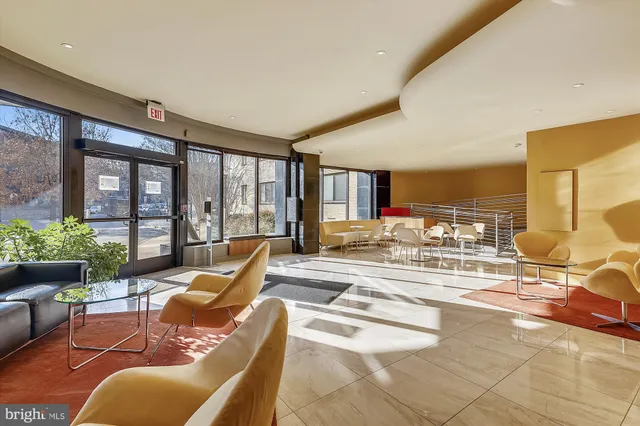 a bedroom with a bed and glass door