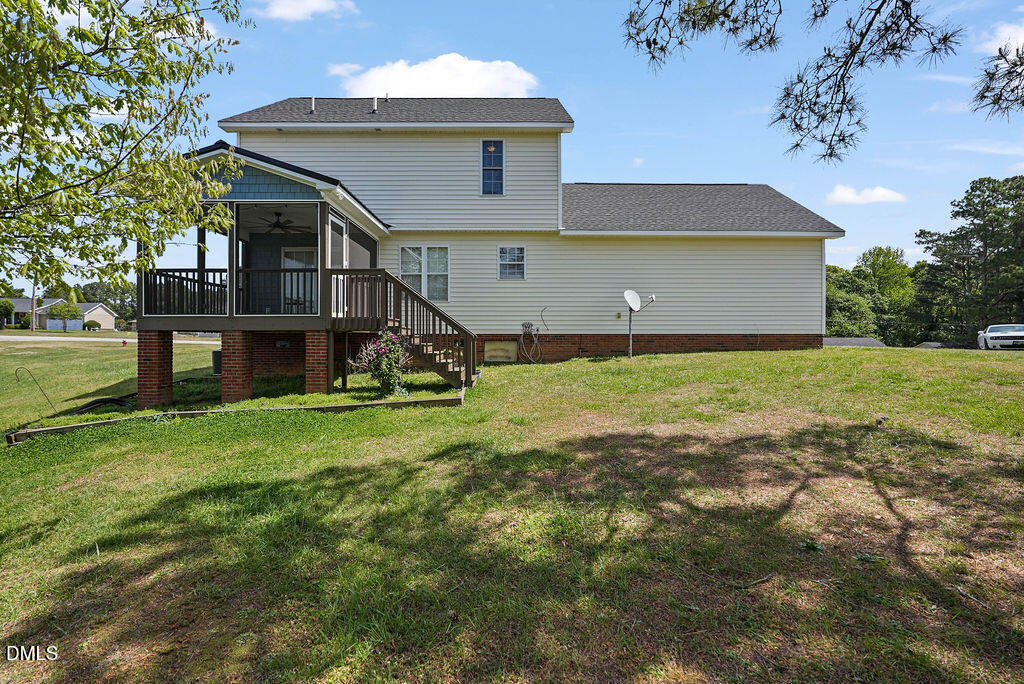 1560 Cane Mill Road Coats, NC 27521 - Photo 31 of 32 a view of a house with a yard