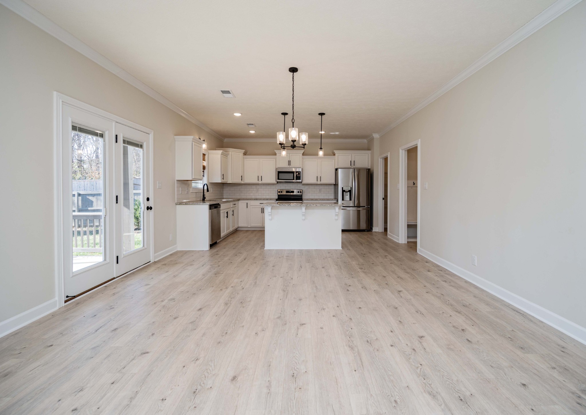 1600 Malone Way Clarksville, TN 37043 - Photo 11 of 39 a open kitchen with stainless steel appliances granite countertop a dishwasher and refrigerator