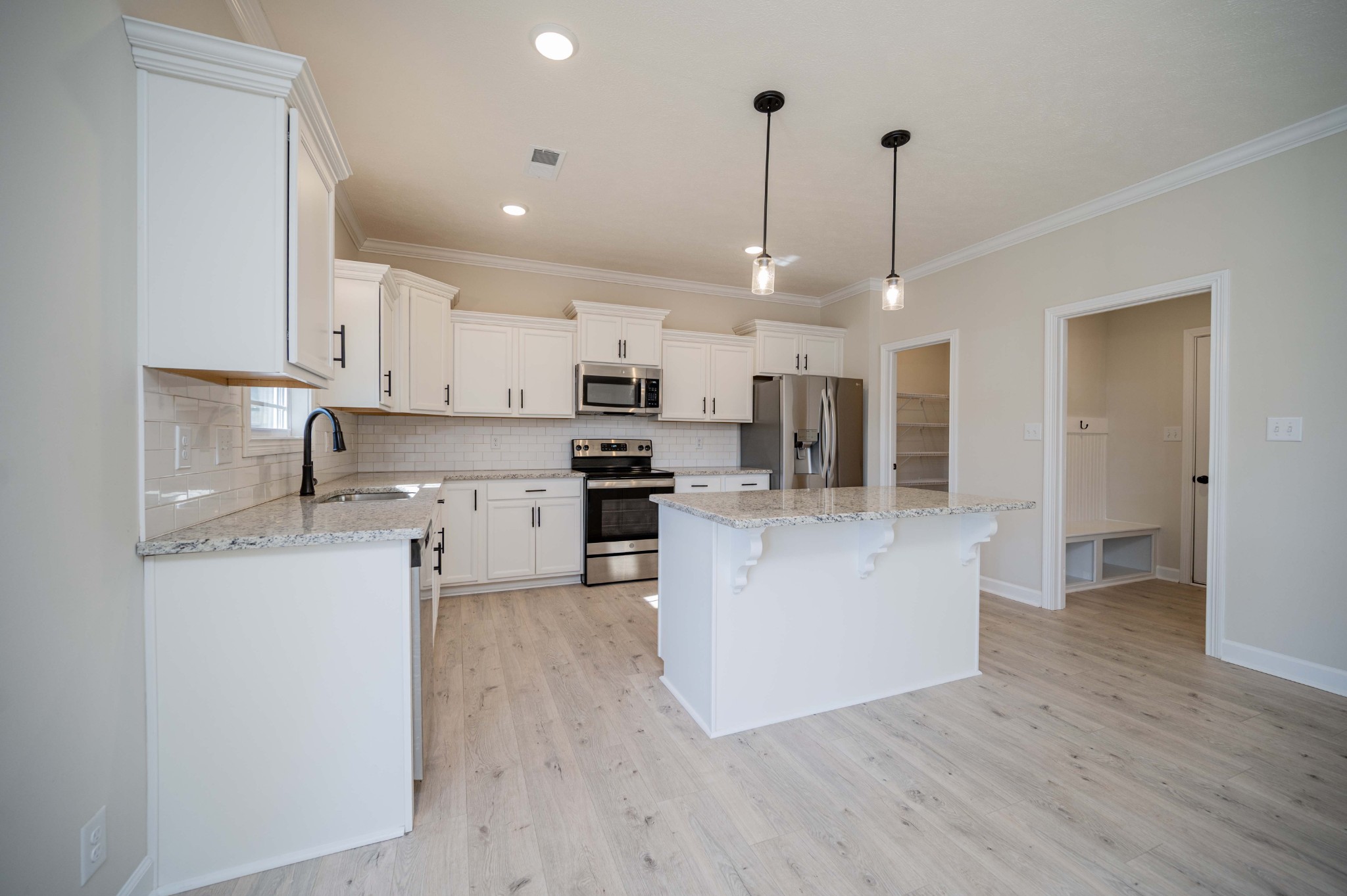1600 Malone Way Clarksville, TN 37043 - Photo 14 of 39 a kitchen with stainless steel appliances kitchen island a refrigerator a stove a sink and a oven