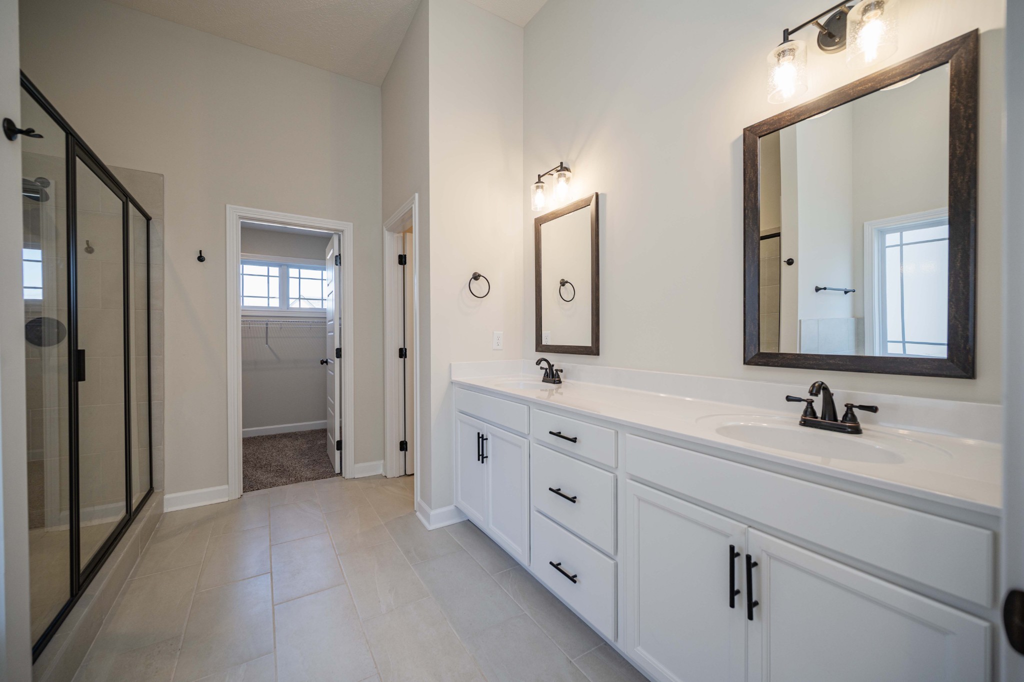 1600 Malone Way Clarksville, TN 37043 - Photo 29 of 39 a bathroom with double vanity sinks and a mirror