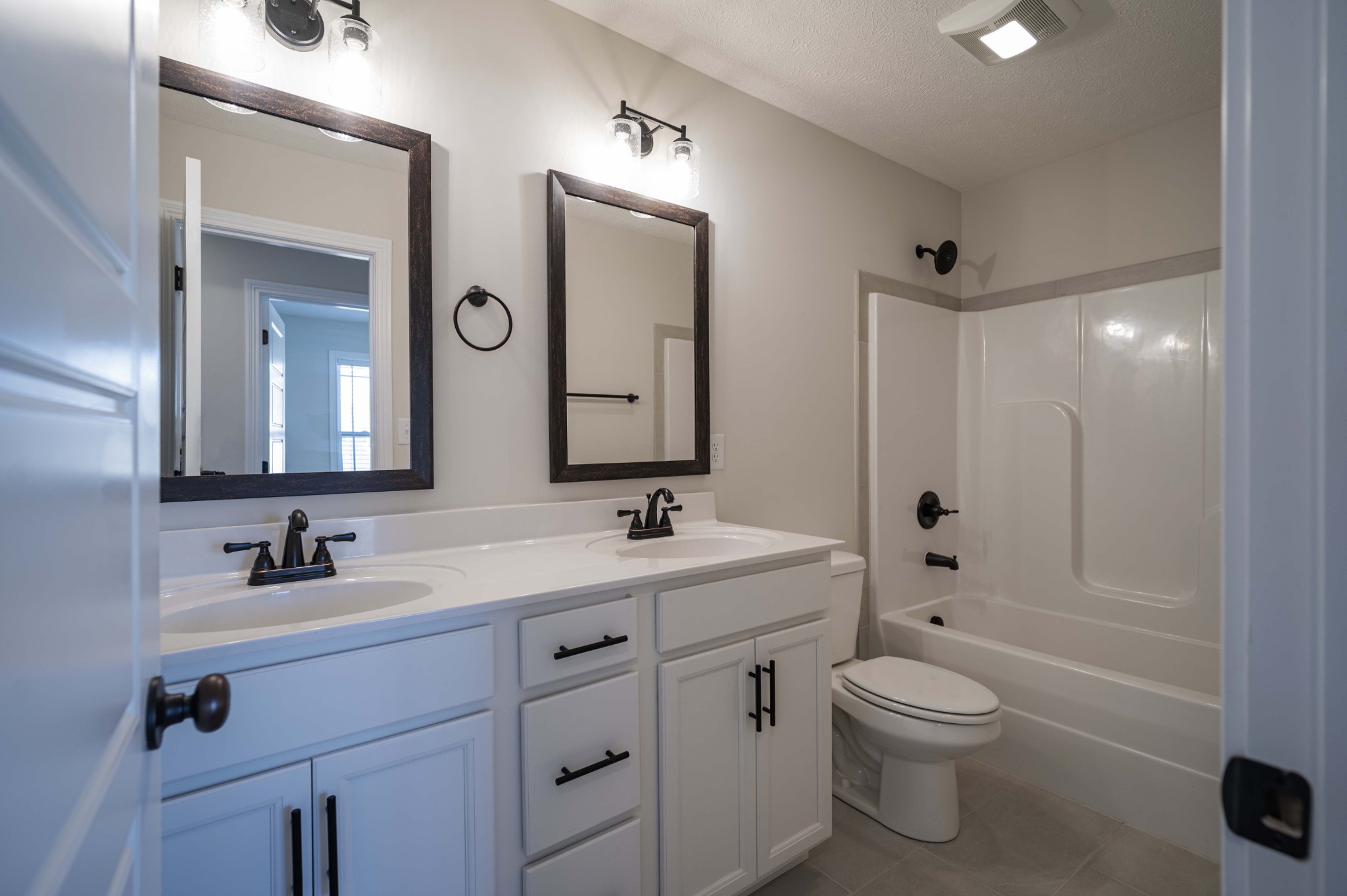 1600 Malone Way Clarksville, TN 37043 - Photo 35 of 39 a bathroom with a toilet a sink a mirror a bathtub and vanity