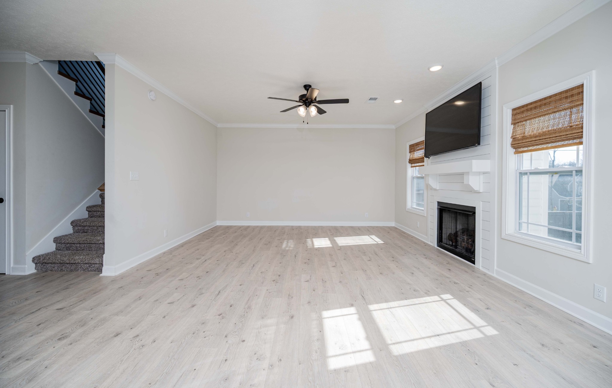 1600 Malone Way Clarksville, TN 37043 - Photo 8 of 39 wooden floor in an empty room with a fireplace