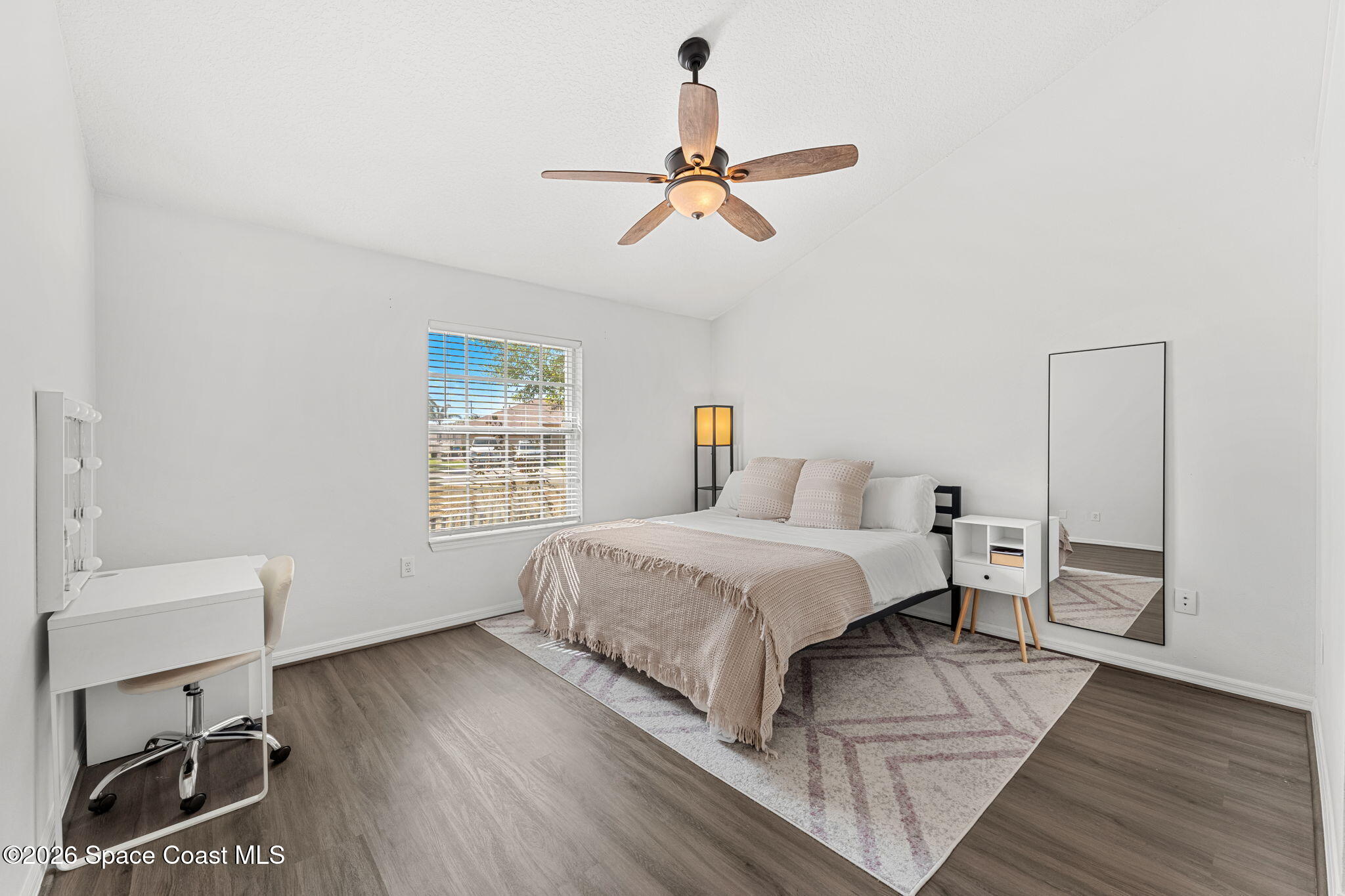 1924 Fabien Circle Melbourne, FL 32940 - Photo 15 of 35 a bedroom with a bed and a window