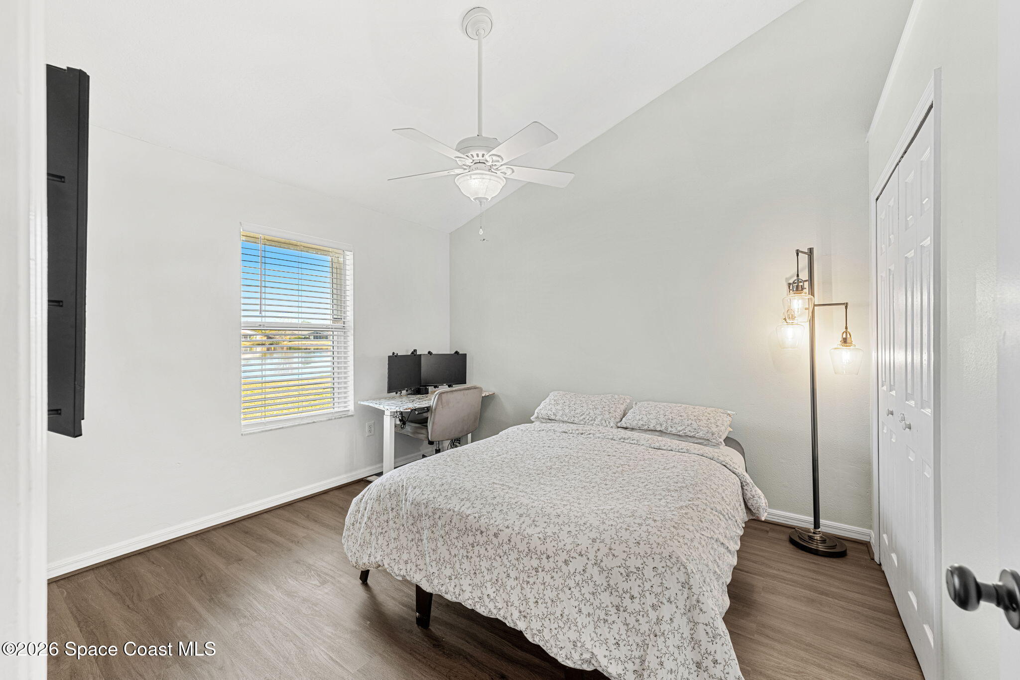 1924 Fabien Circle Melbourne, FL 32940 - Photo 21 of 35 a bedroom with a bed dresser and a window
