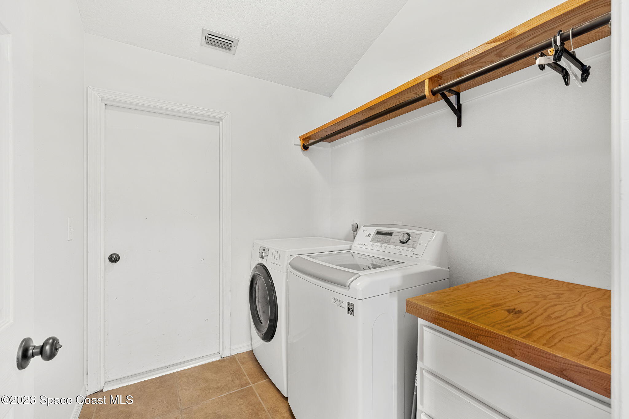 1924 Fabien Circle Melbourne, FL 32940 - Photo 23 of 35 a utility room with dryer and washer