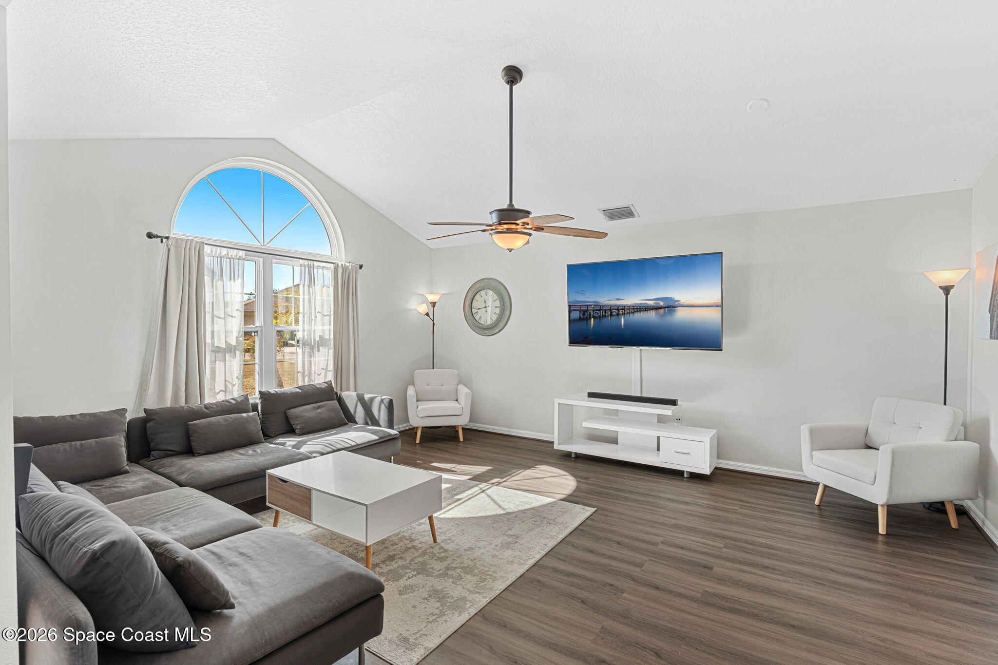 1924 Fabien Circle Melbourne, FL 32940 - Photo 7 of 35 a living room with furniture and a wooden floor
