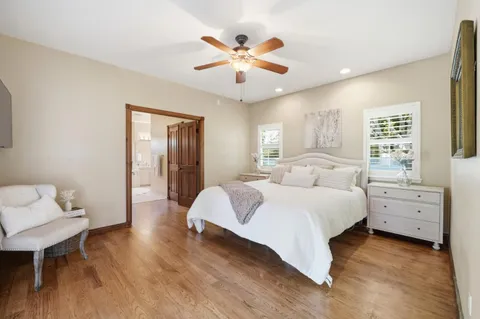 a spacious bedroom with a bed and window