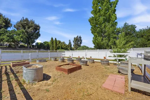 a view of a backyard with sitting area