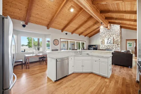 a large room with lots of wooden furniture and a bathtub