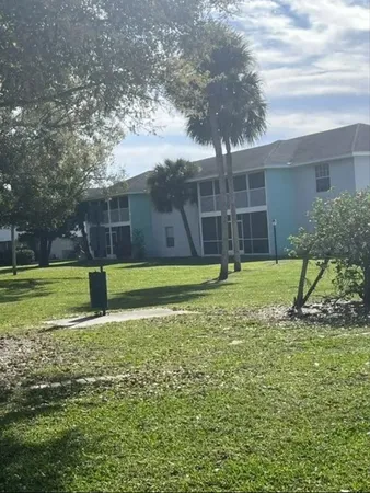 a view of a backyard with a trampoline