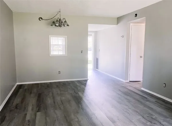 a view of an empty room with a balcony