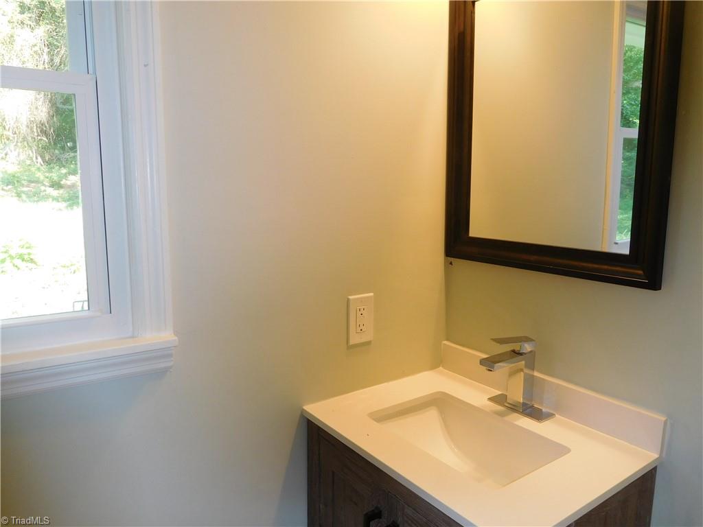 6454 Germanton Road Rural Hall, NC 27045 - Photo 18 of 28 Primary Bathroom has all new flooring and vanity.