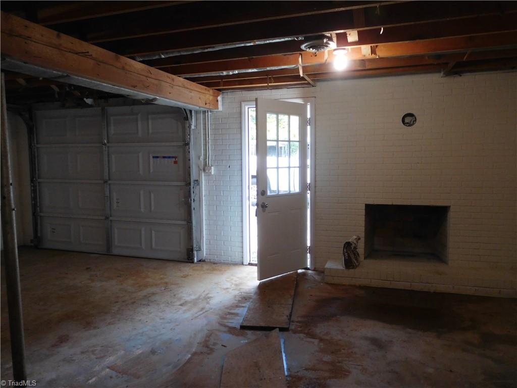 6454 Germanton Road Rural Hall, NC 27045 - Photo 25 of 28 Fully unfinished basement with one car garage and 2nd Fireplace. Tons of storage options and Laundry is located in basement. Walk-out basement.