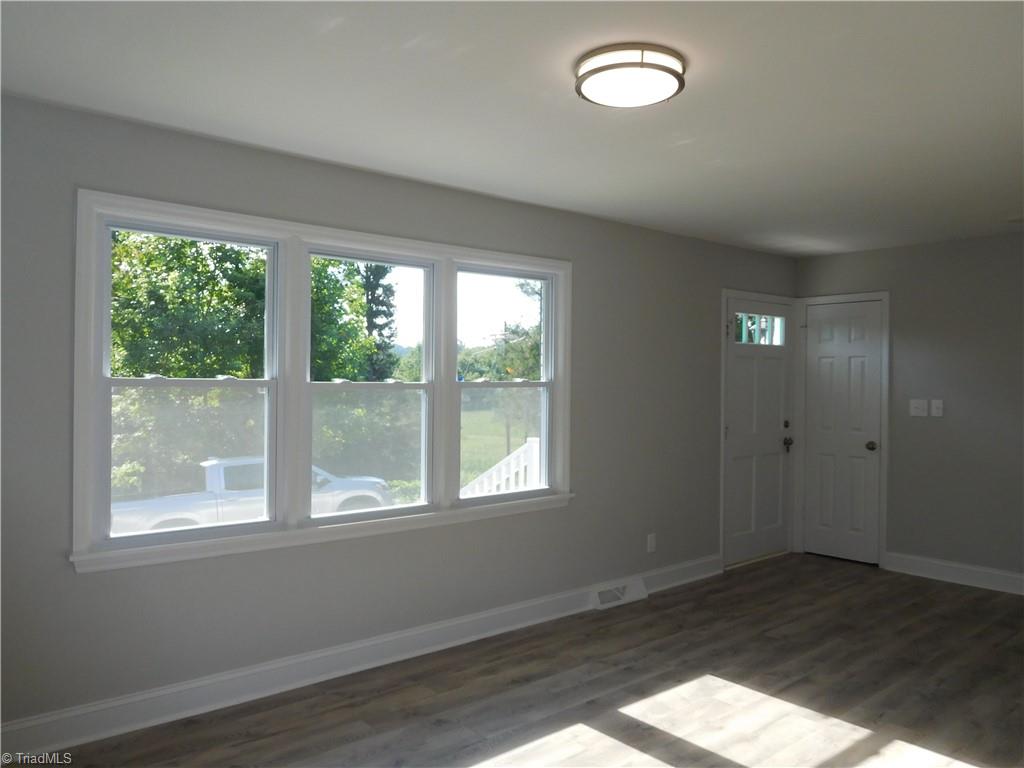 6454 Germanton Road Rural Hall, NC 27045 - Photo 4 of 28 All New Flooring throughout. Fresh interior and exterior paint, all new light fixtures.