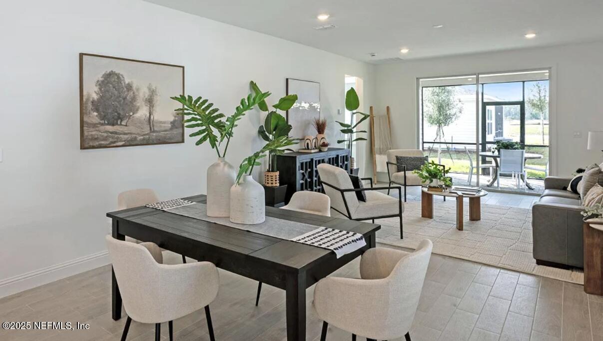 3125 Adelaide Road Green Cove Springs, FL 32043 - Photo 37 of 47 a view of a dining room with furniture window and wooden floor
