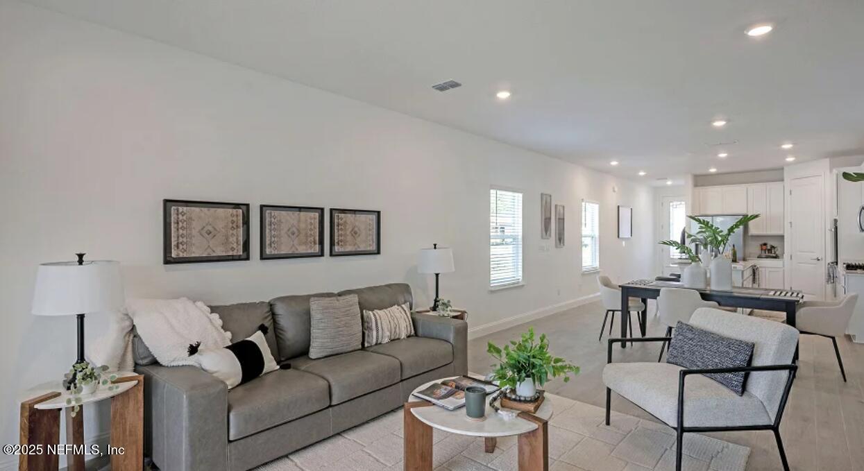 3125 Adelaide Road Green Cove Springs, FL 32043 - Photo 39 of 47 a living room with furniture and a wooden floor