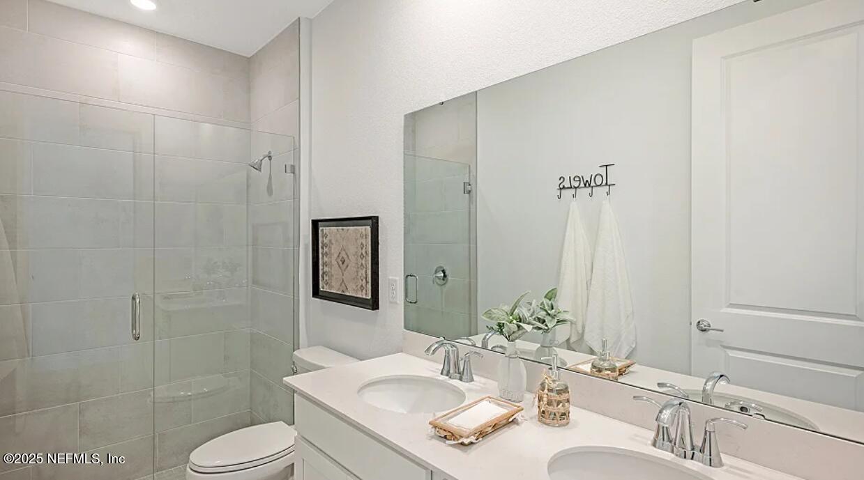 3125 Adelaide Road Green Cove Springs, FL 32043 - Photo 46 of 47 a bathroom with a sink toilet and shower