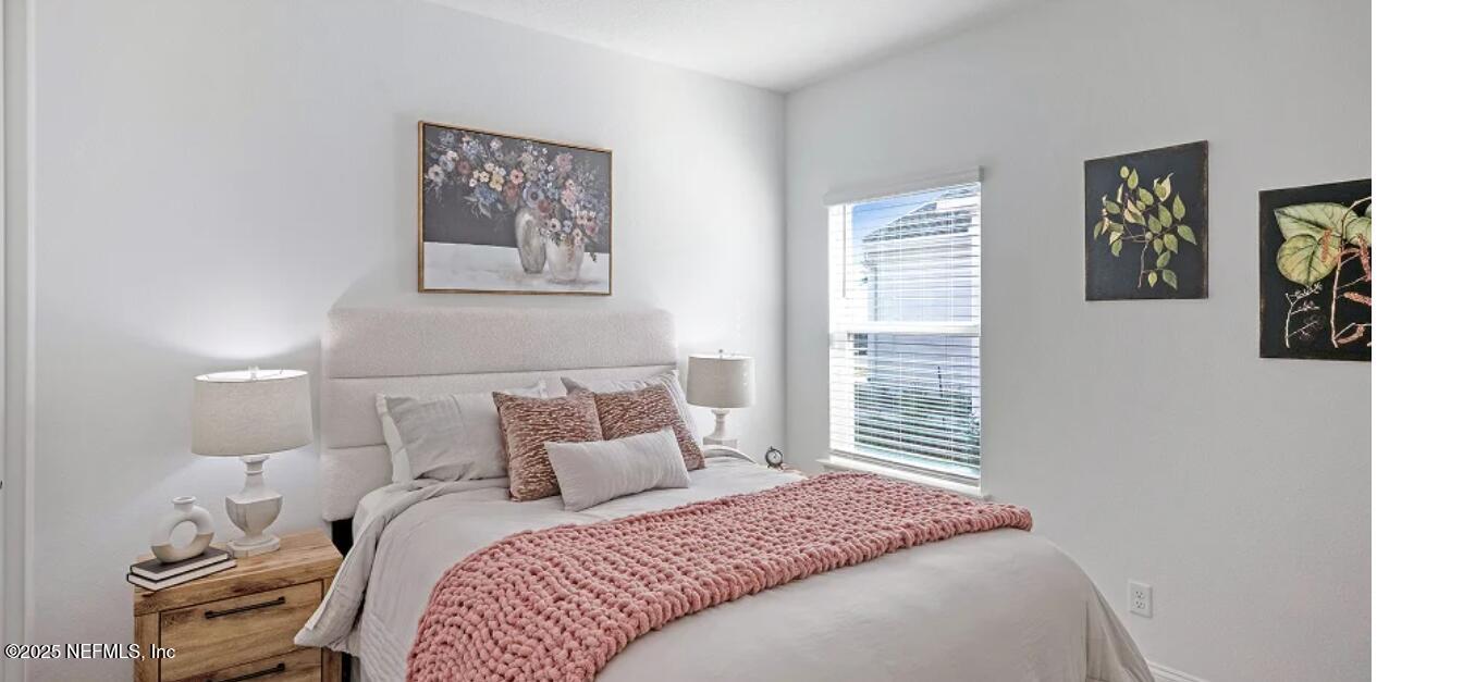 3125 Adelaide Road Green Cove Springs, FL 32043 - Photo 47 of 47 a bedroom with a bed and a painting on the wall