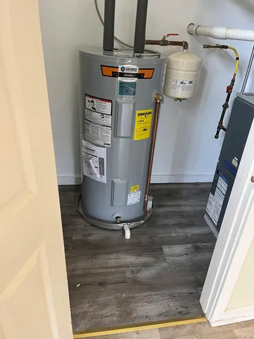 a view of storage and utility room with a refrigerator