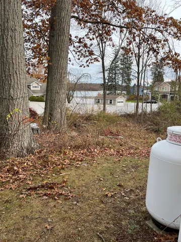 a view of a lake with a big yard