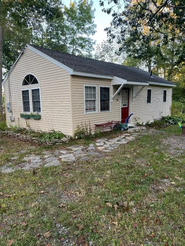 a house view with a backyard space