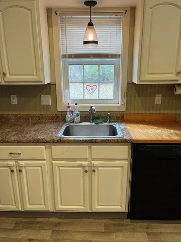 a kitchen with granite countertop white cabinets and a granite counter tops