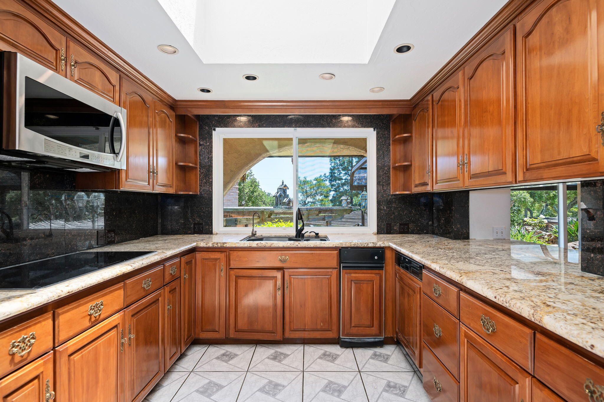 2106 Mt Calvary Road Santa Barbara, CA 93105 - Photo 17 of 66 a kitchen with stainless steel appliances granite countertop a sink and a stove