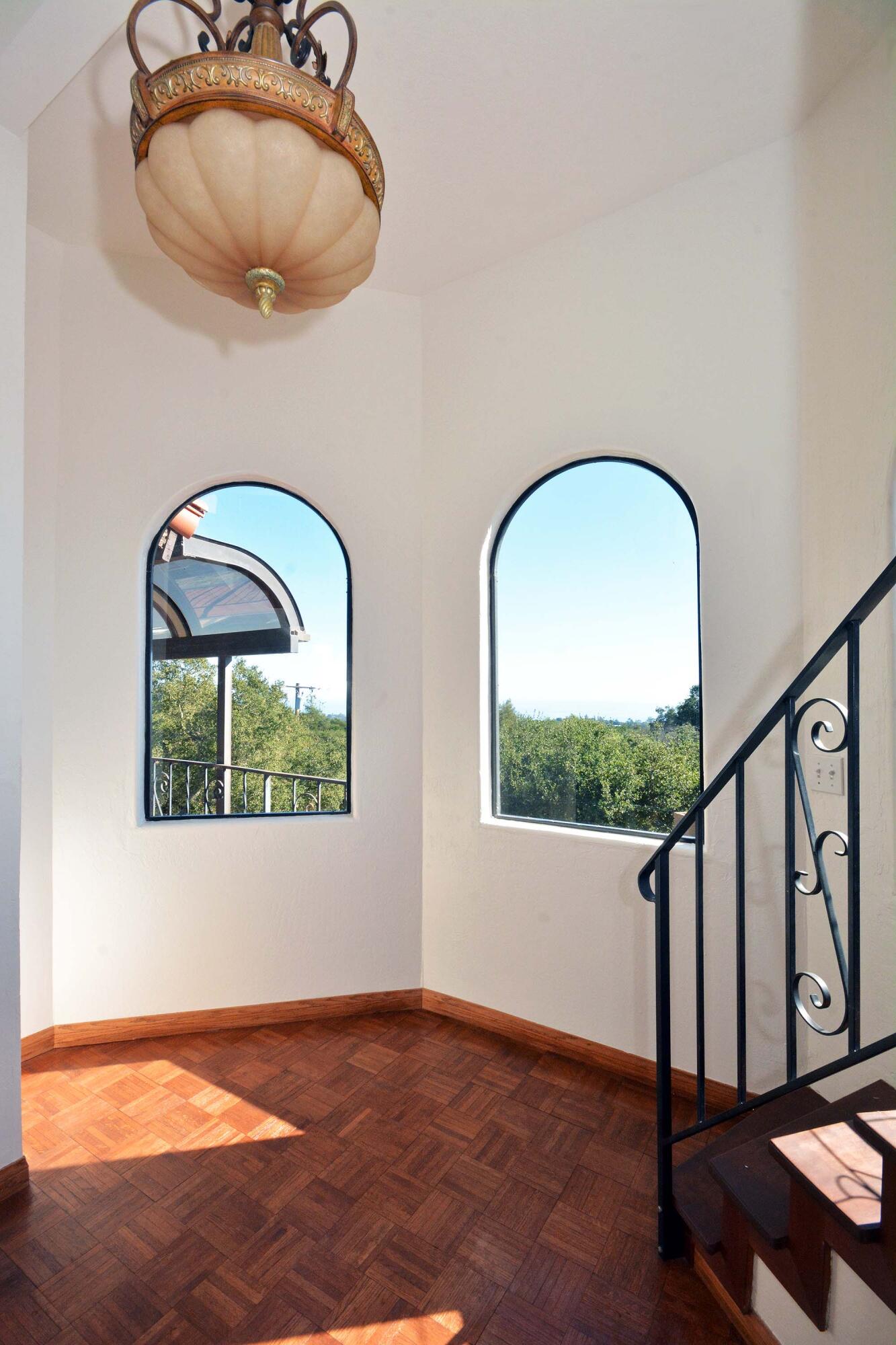 2106 Mt Calvary Road Santa Barbara, CA 93105 - Photo 21 of 66 a view of staircase with wooden floor and a potted plant