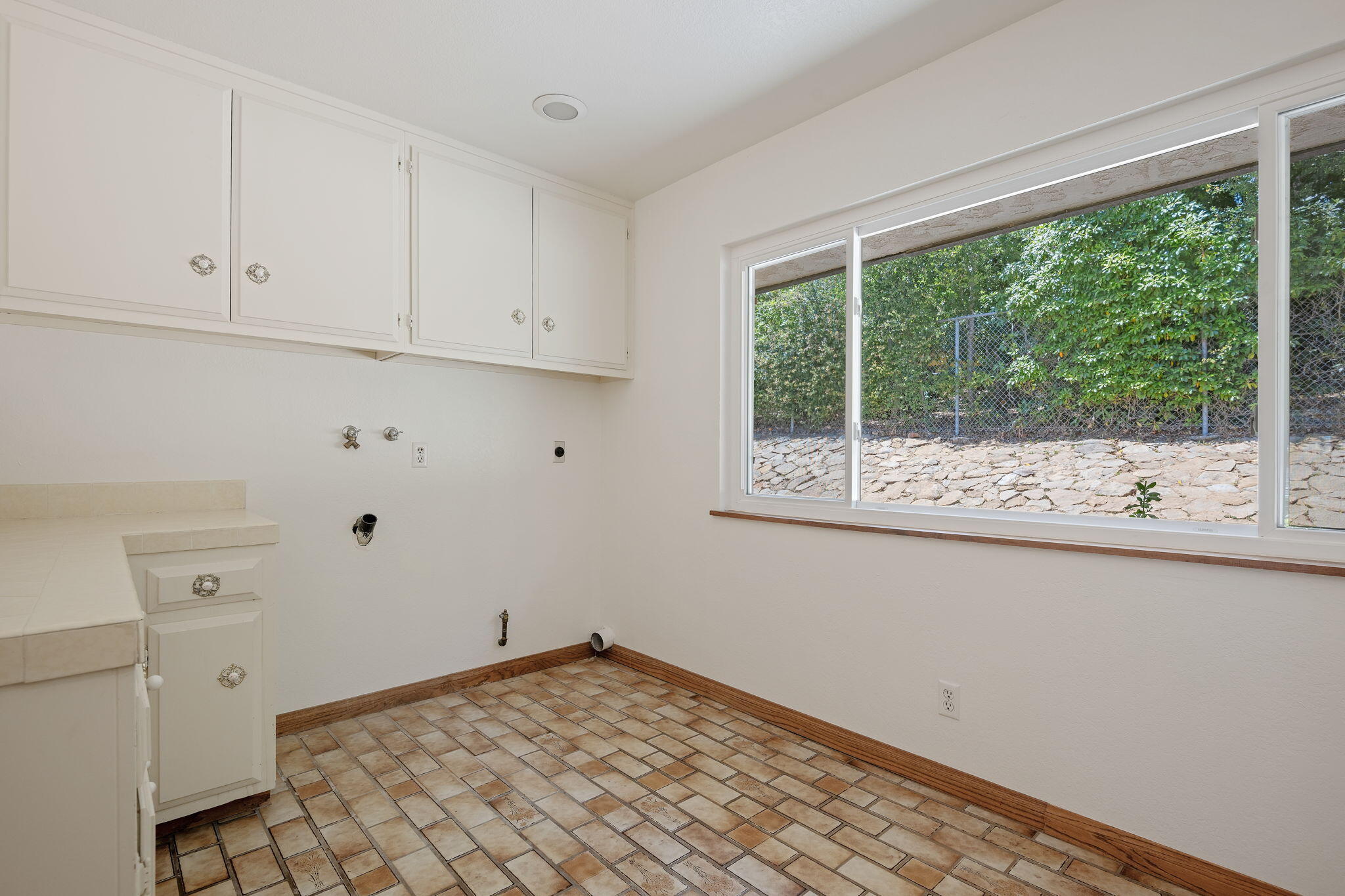 2106 Mt Calvary Road Santa Barbara, CA 93105 - Photo 39 of 66 a view of a kitchen with wooden floor and a window